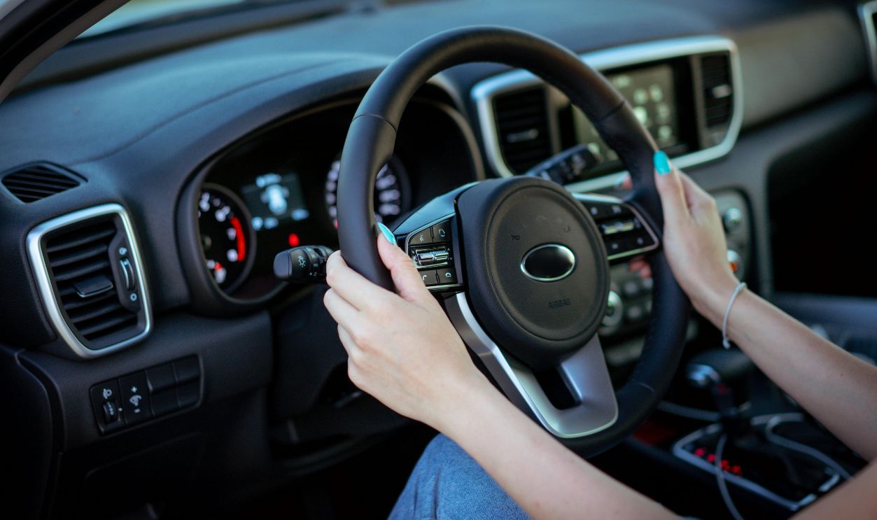Woman Hands Holding Steering Wheel