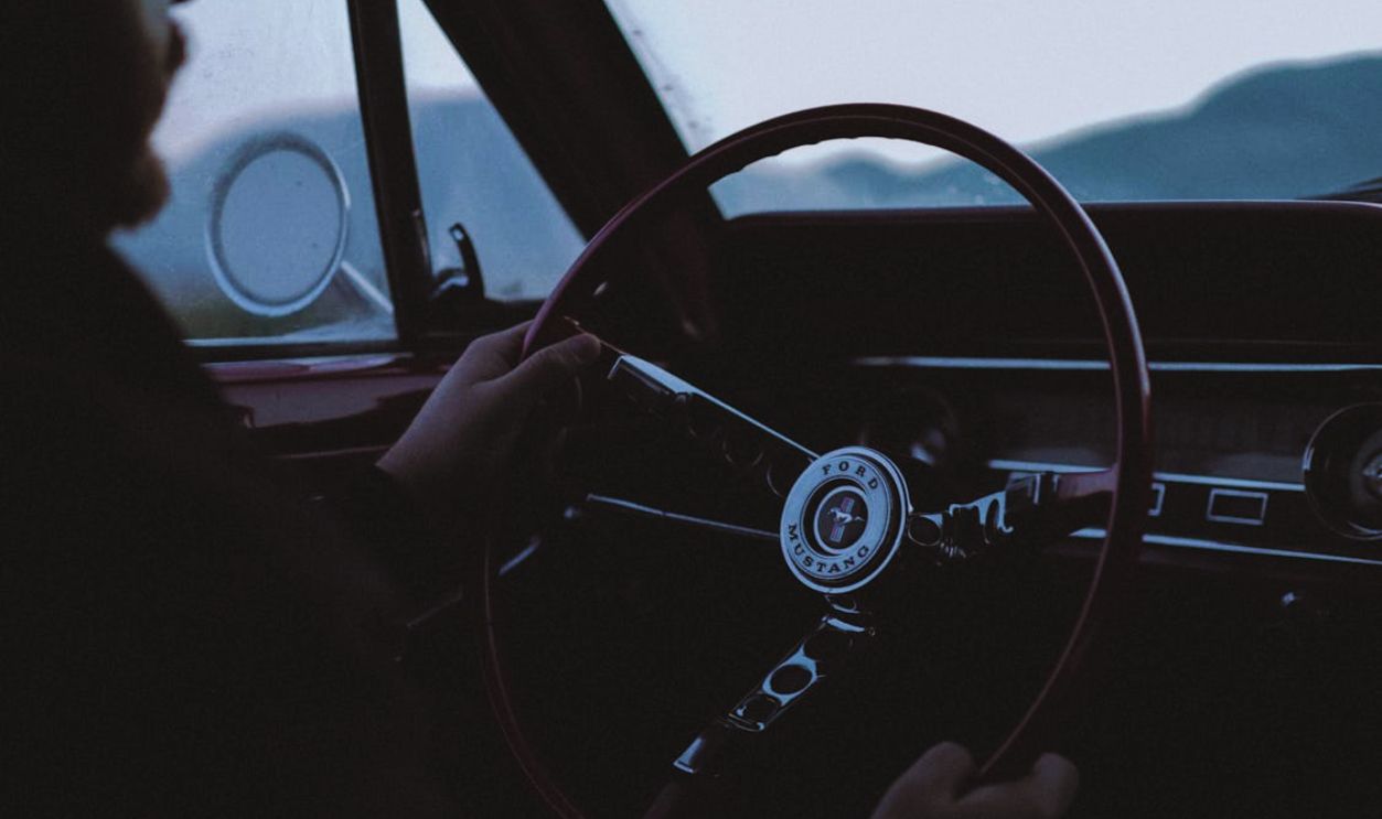 Man Driving a Vintage Car