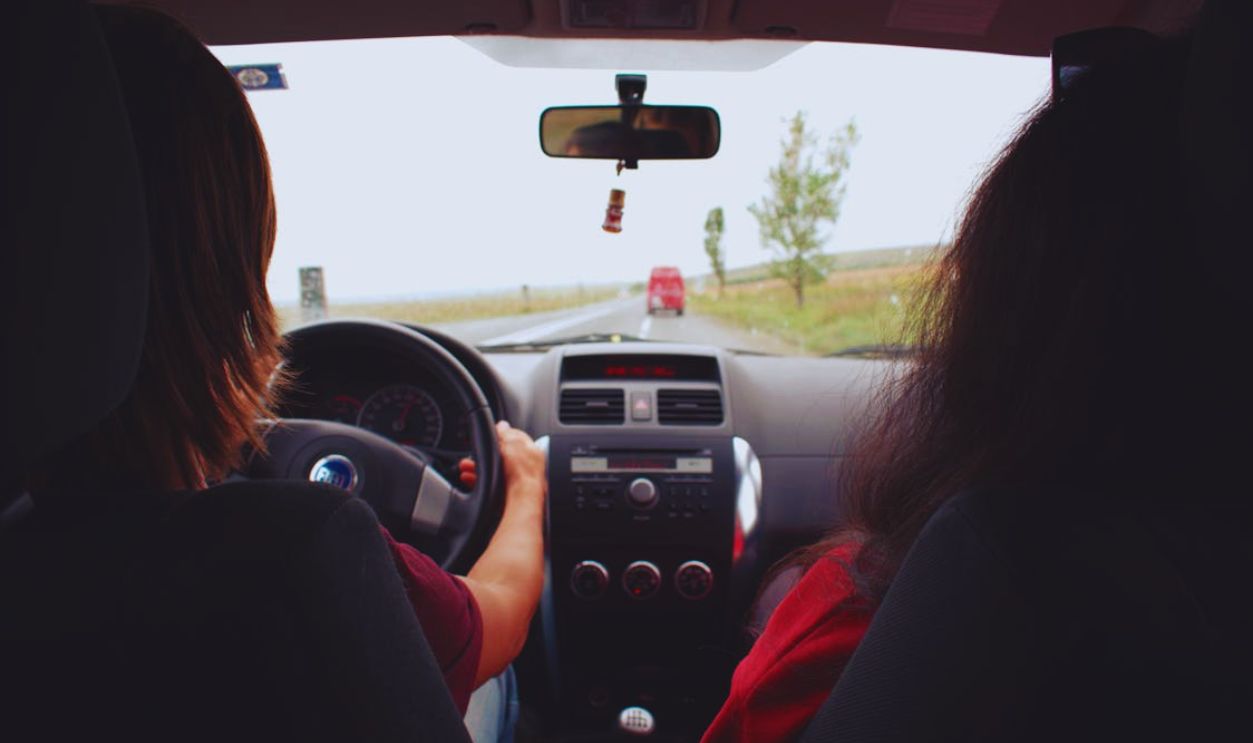 Two Woman Sitting Inside Vehicle