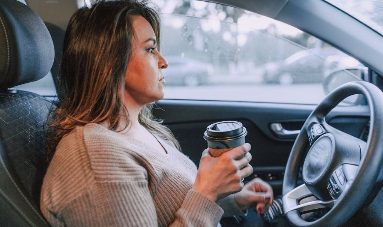 Woman holding a Disposable Cup