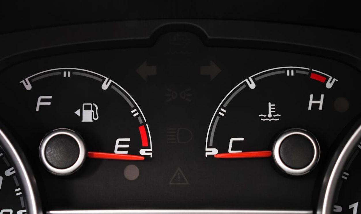 Fuel and Temperature Gauges on a Black Panel Board