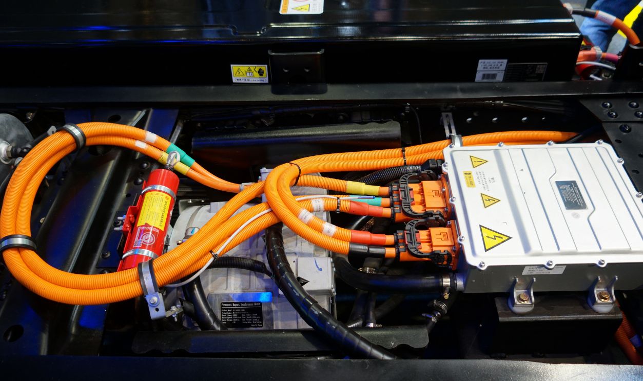 Jakarta, Indonesia - 4 May 2025: Close-up of high-voltage cables and power control unit in an electric light truck, highlighting advanced EV powertrain and energy transmission technology.