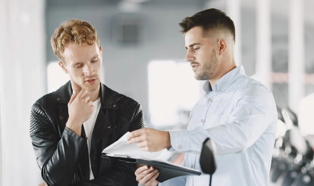 Customer Talking to the Motor Vehicle Dealer