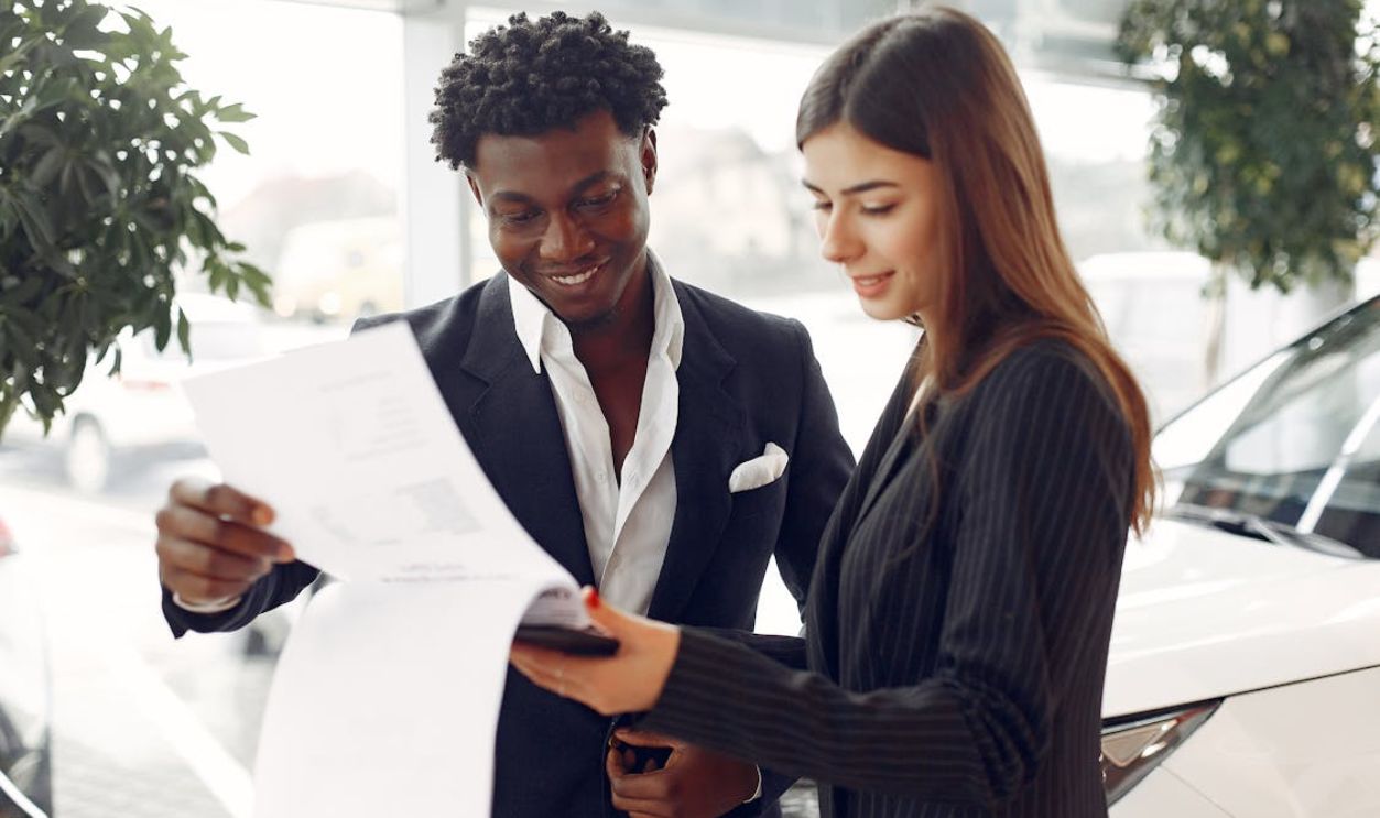 Happy Customer and Agent Reading the Contract