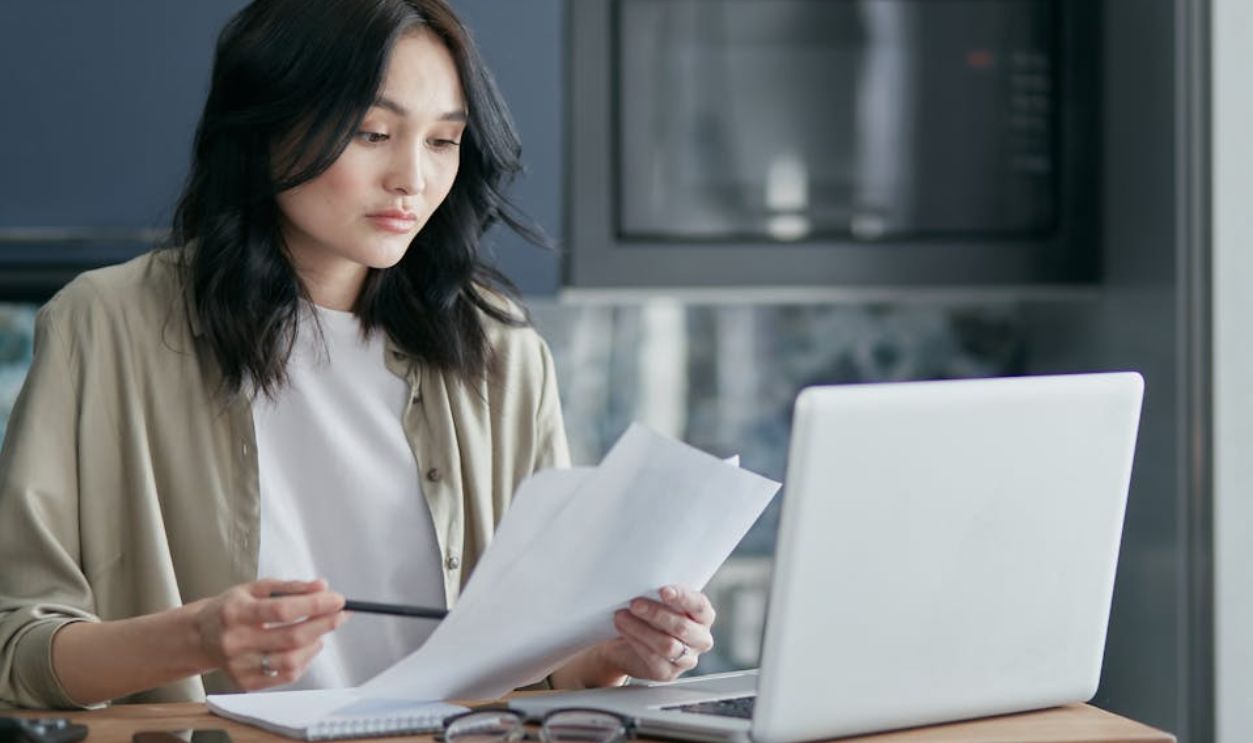 Woman Holding Papers