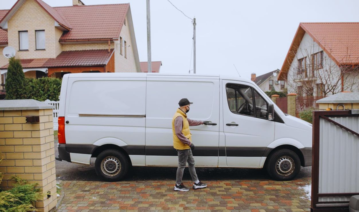 Man Opening a Delivery Van