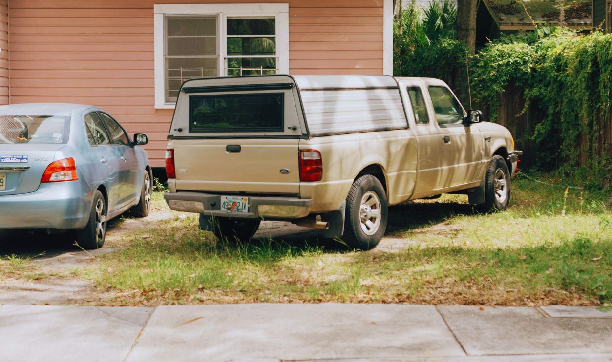 Two Cars Parked in front of a House