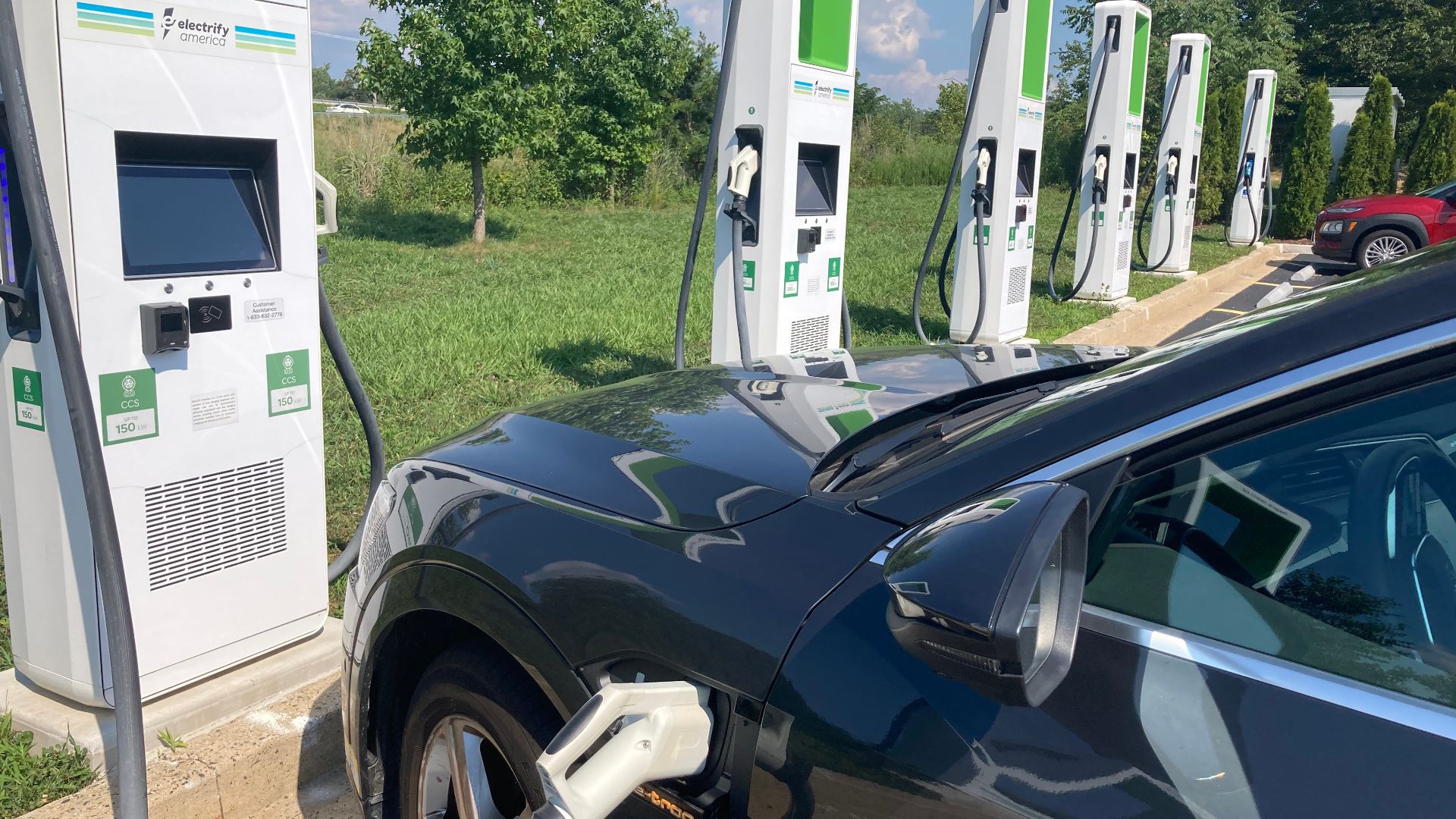 Audi E Tron fully electric vehicle charging at Electrify America Fast Charging station