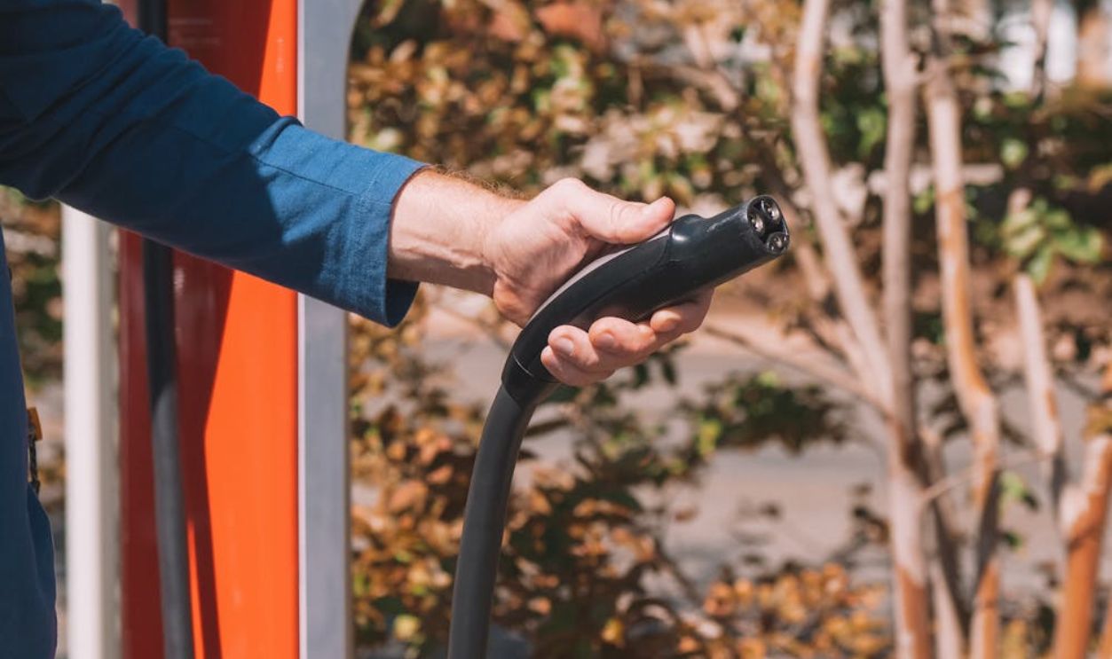 Person with EV charger