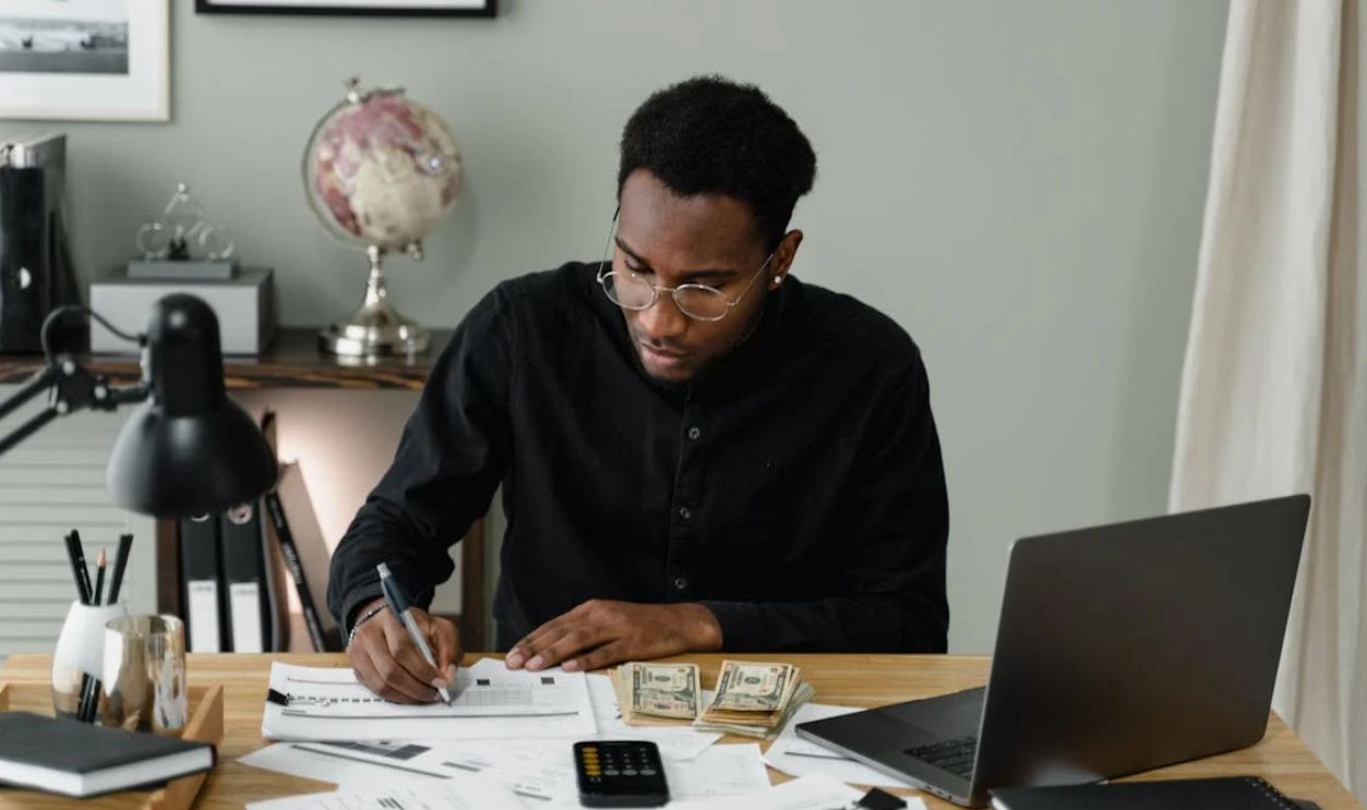 A Man Writing on the Paper