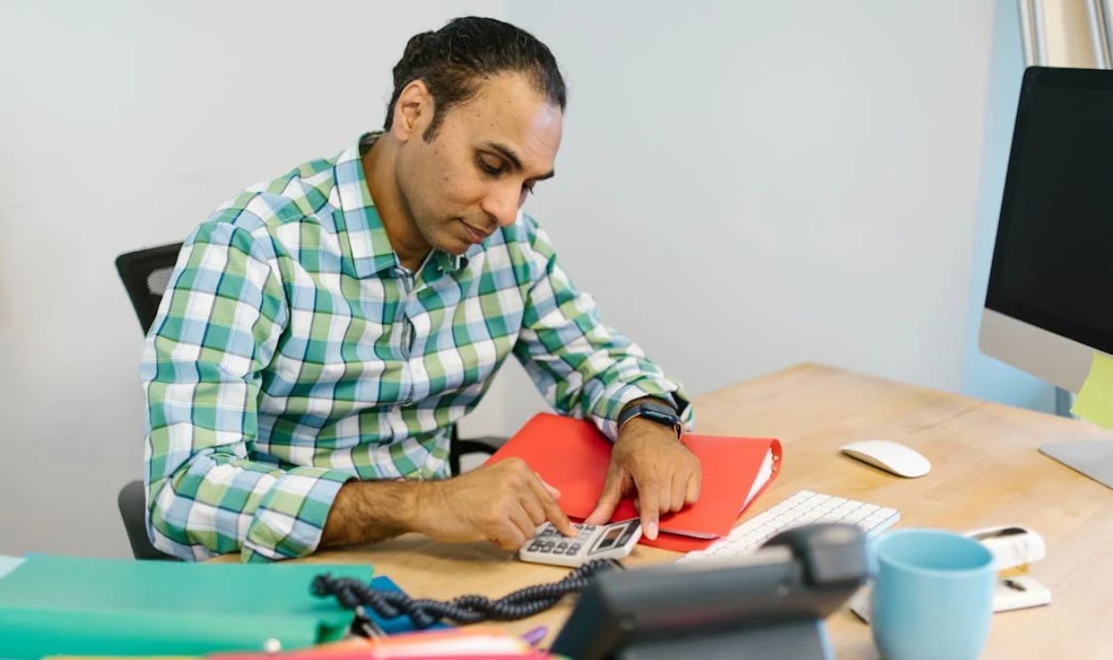 Man Using a Calculator