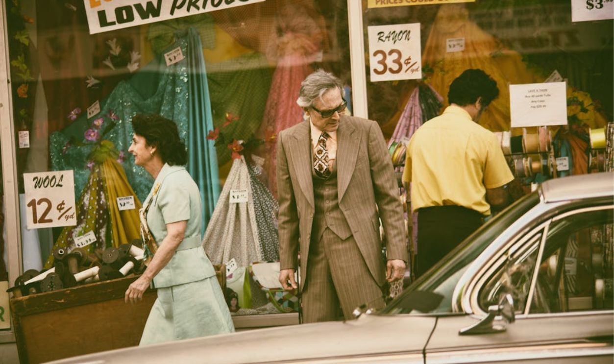 Man Looking At A Vintage Car