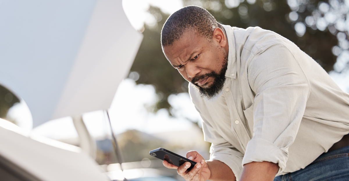 Breakdown, cellphone and black man by car 