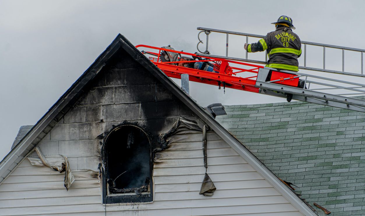 Firefighter on Building Roof