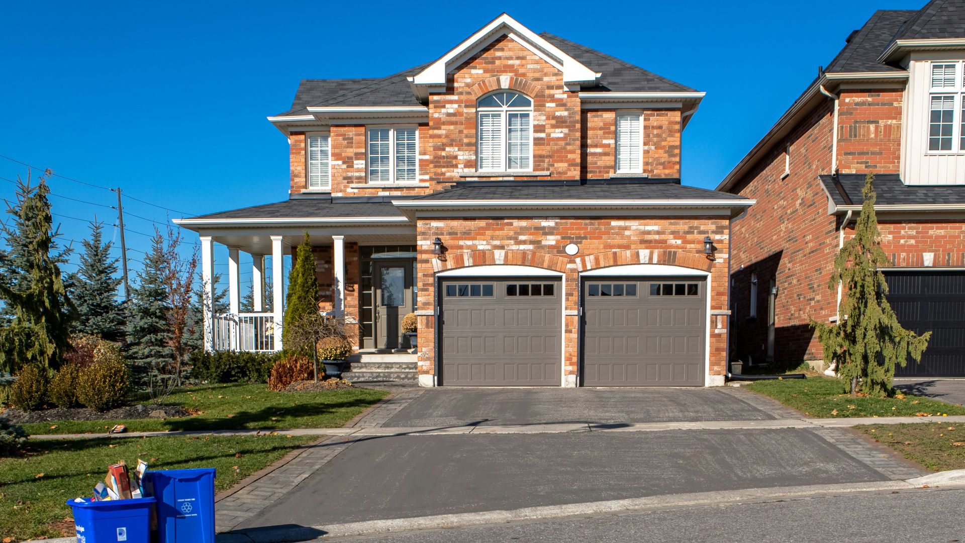 brown and white concrete house under blue sky during daytime
