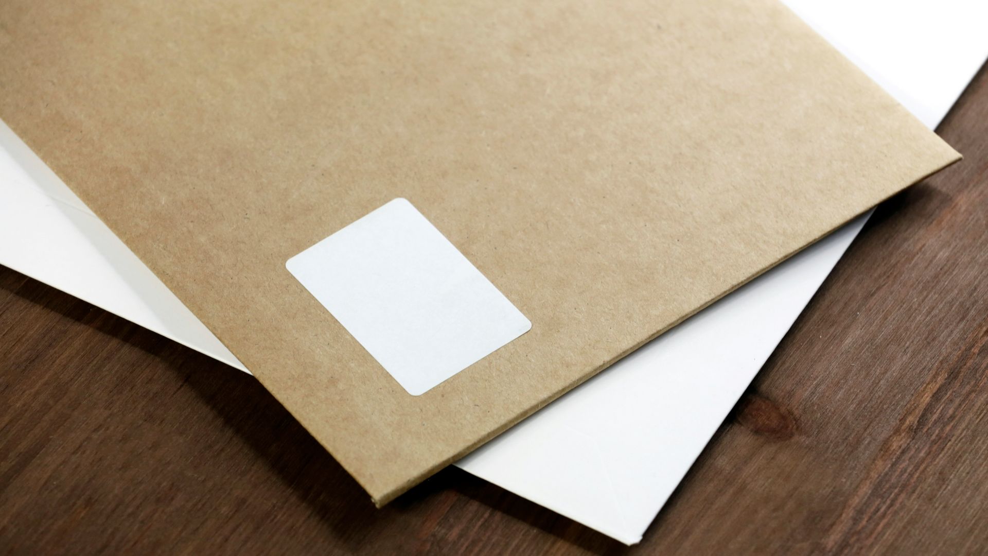 white paper on brown wooden table