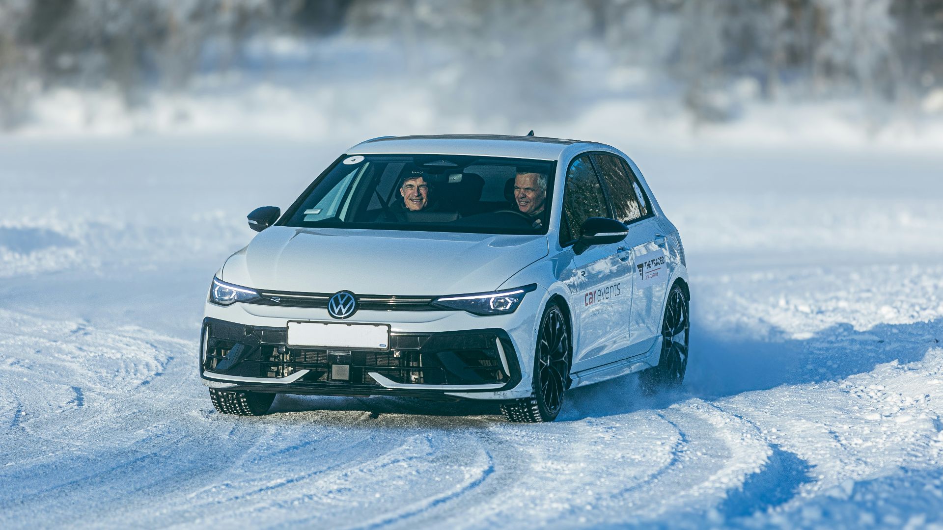 White car drifting on a snowy track