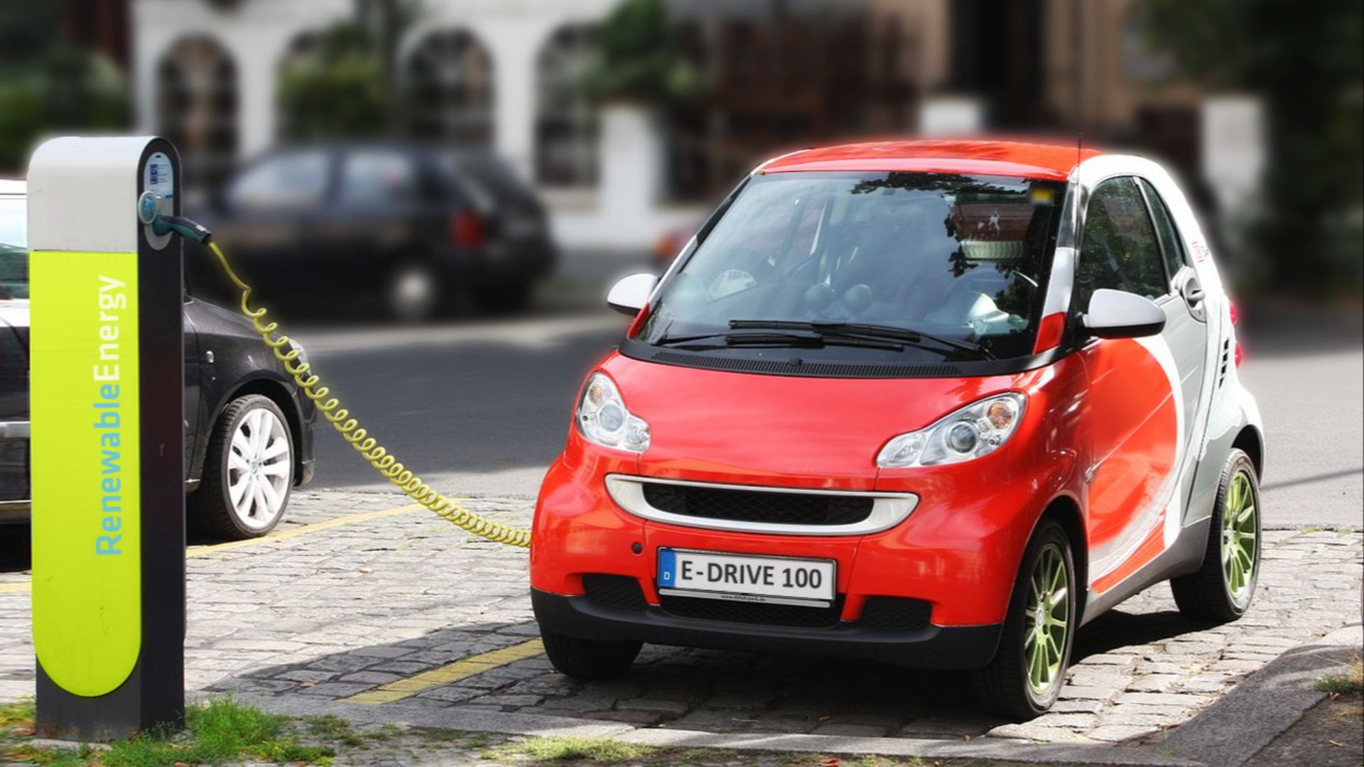 electric car recharging in Berlin, Germany – dummy/fake registration plate and charging station logo