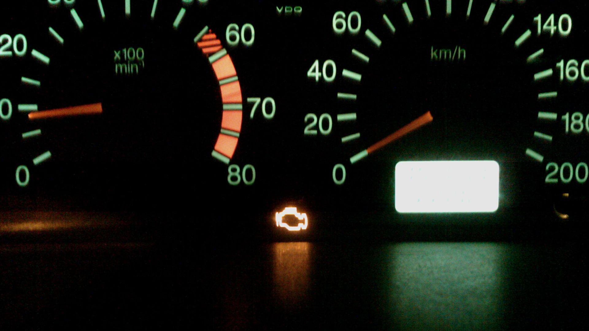 Check Engine lamp on a running engine indicating engine control system malfunction.