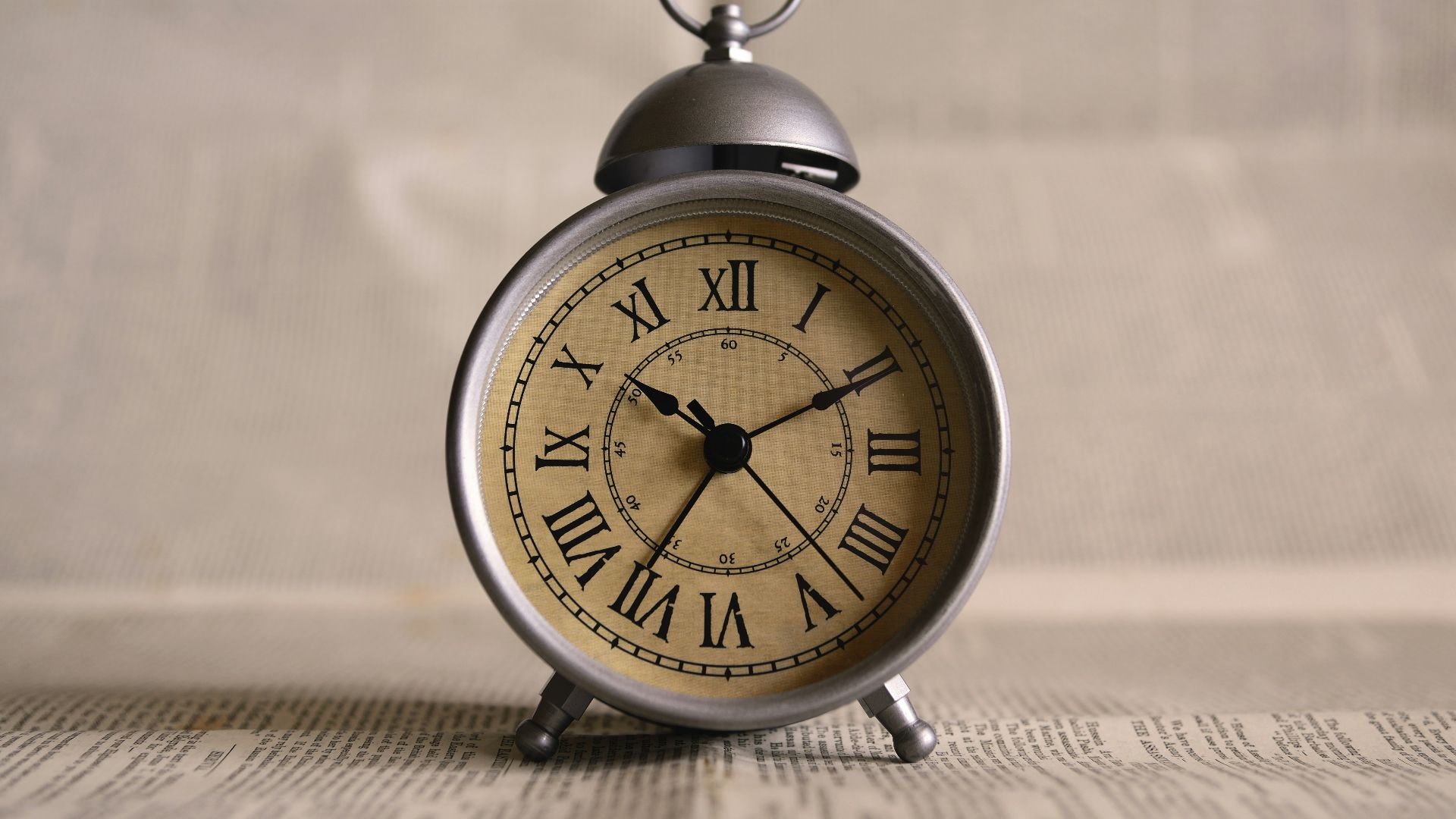 turned on gray alarm clock displaying 10:11