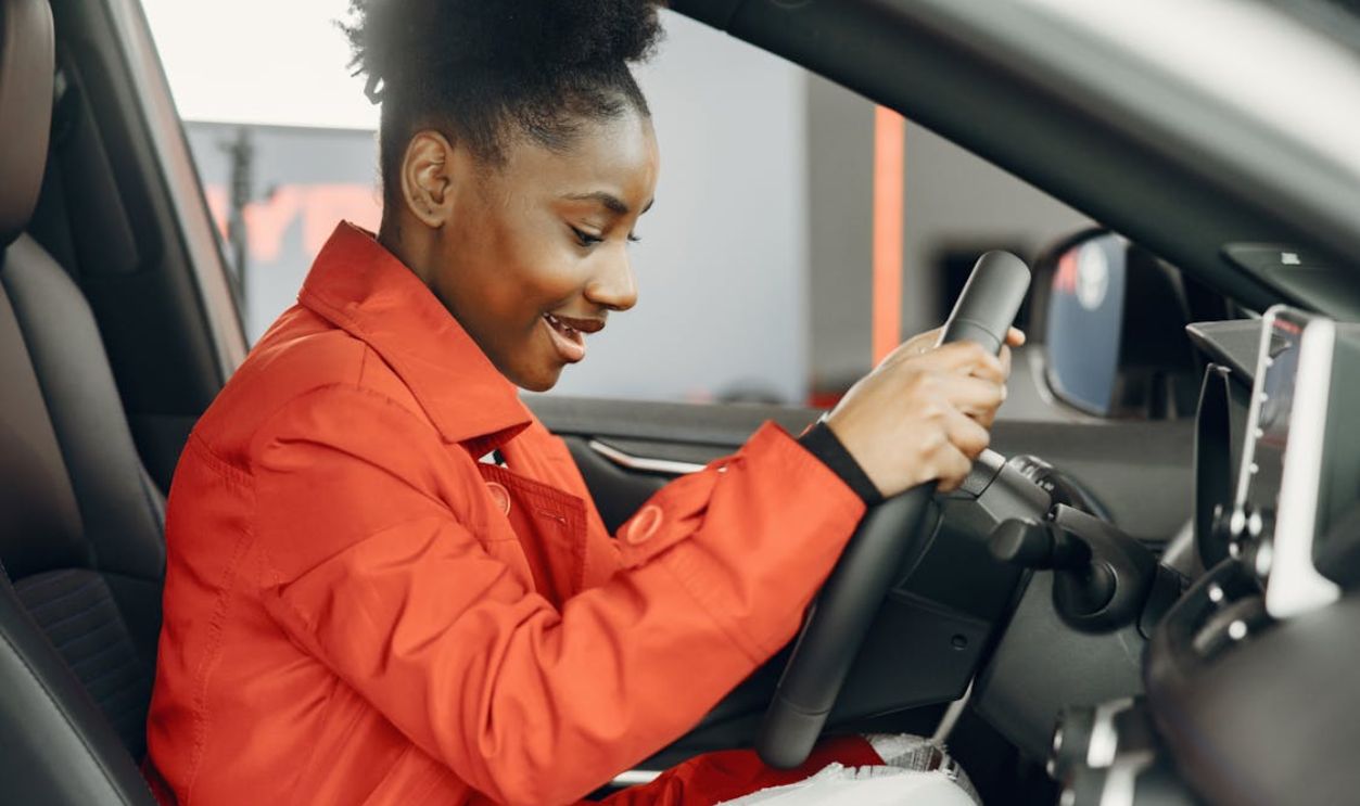 A Young Woman Behind the Steering Wheel