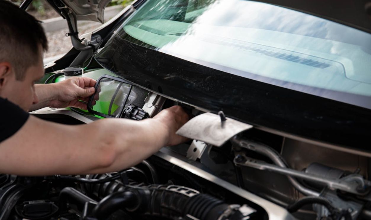 Mechanic Fixing a Car