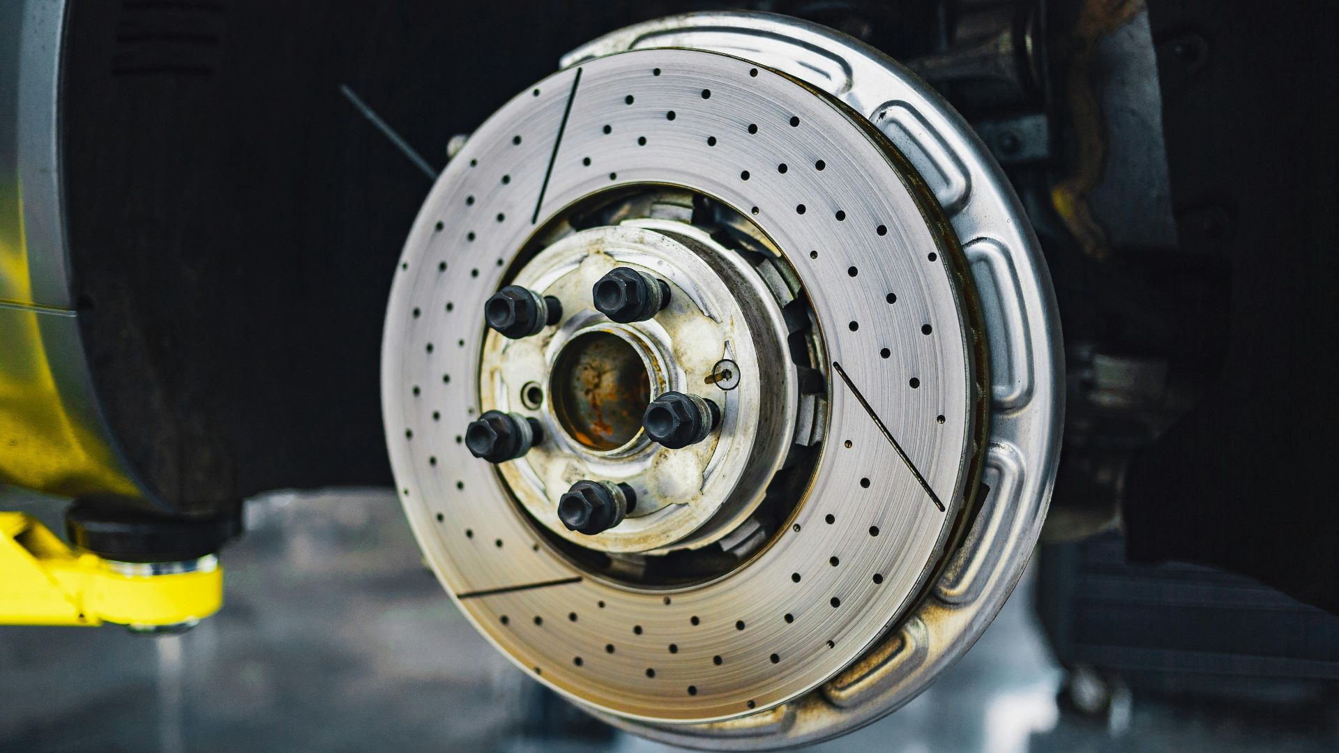 Detailed view of a car brake disk showcasing automotive parts and craftsmanship.