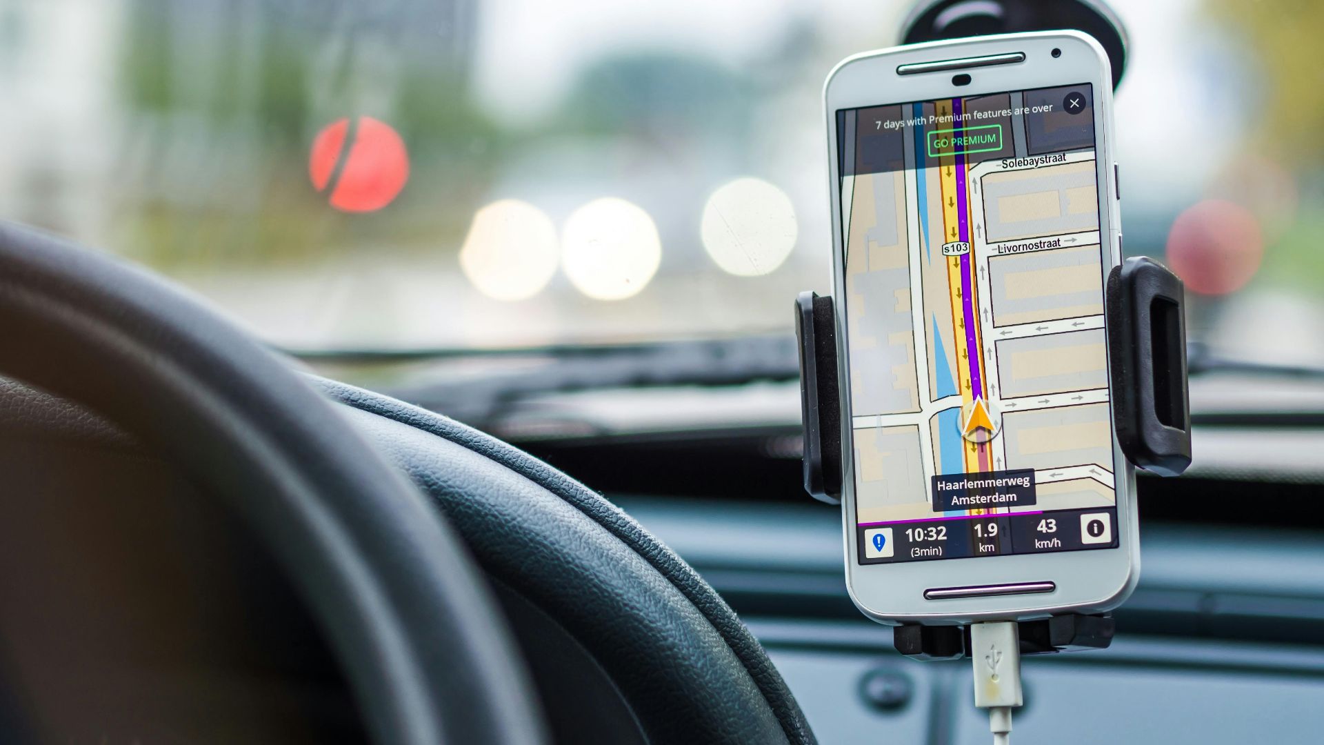 Smartphone mounted in car using GPS for navigation and directions.