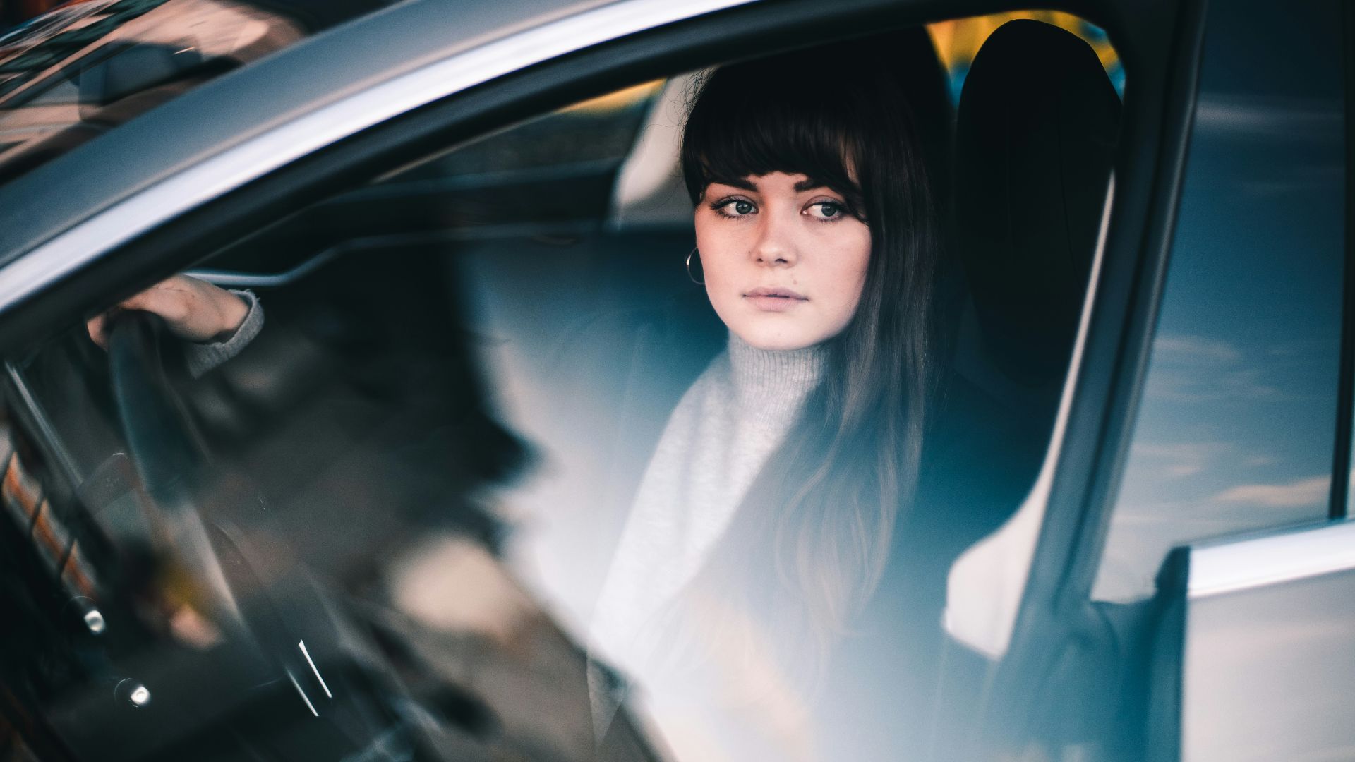woman sitting inside vehicle