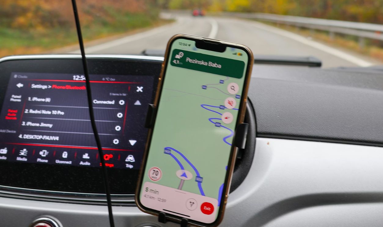 a car dashboard with a cell phone attached to it