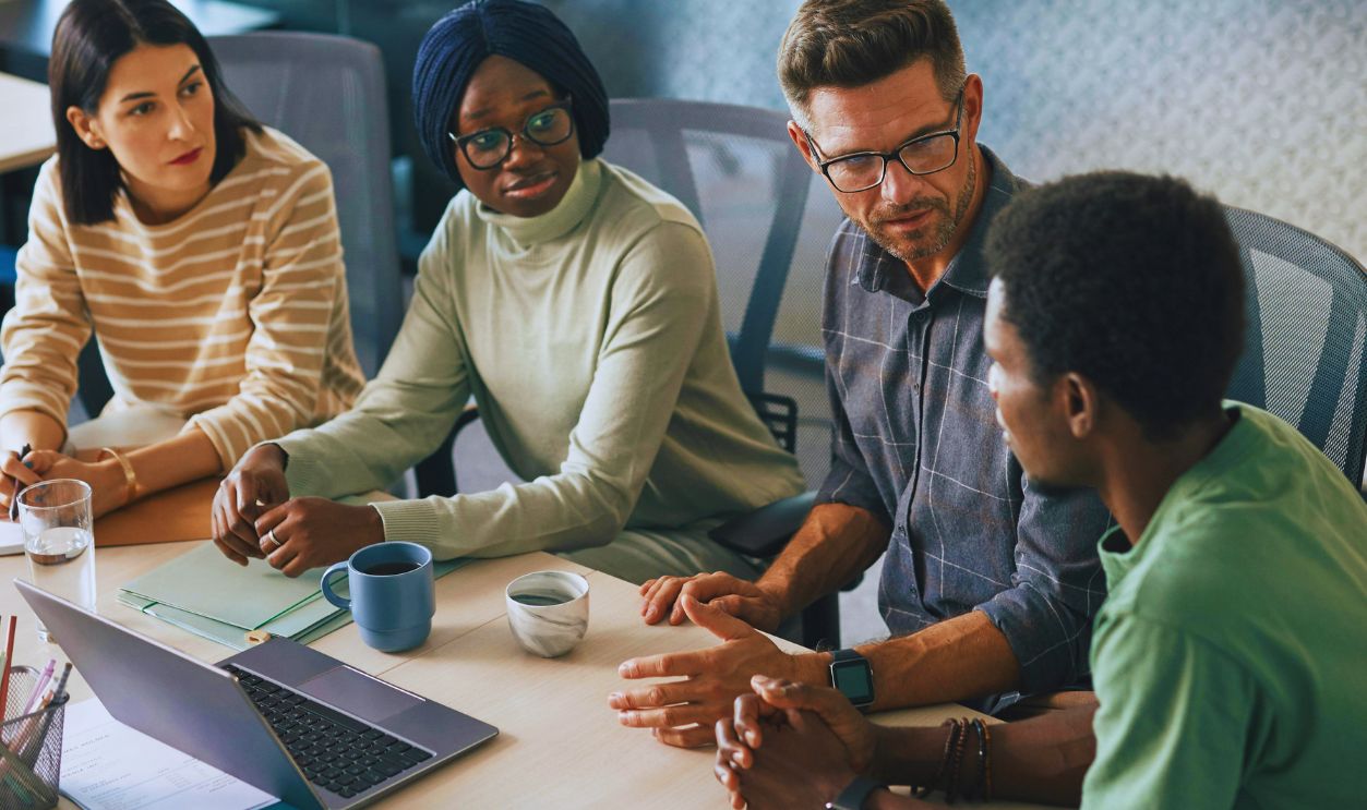 A Group of People Having a Meeting in the Office