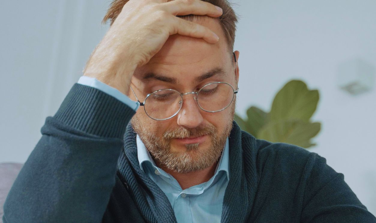 A Man's Face Expressing Desperation