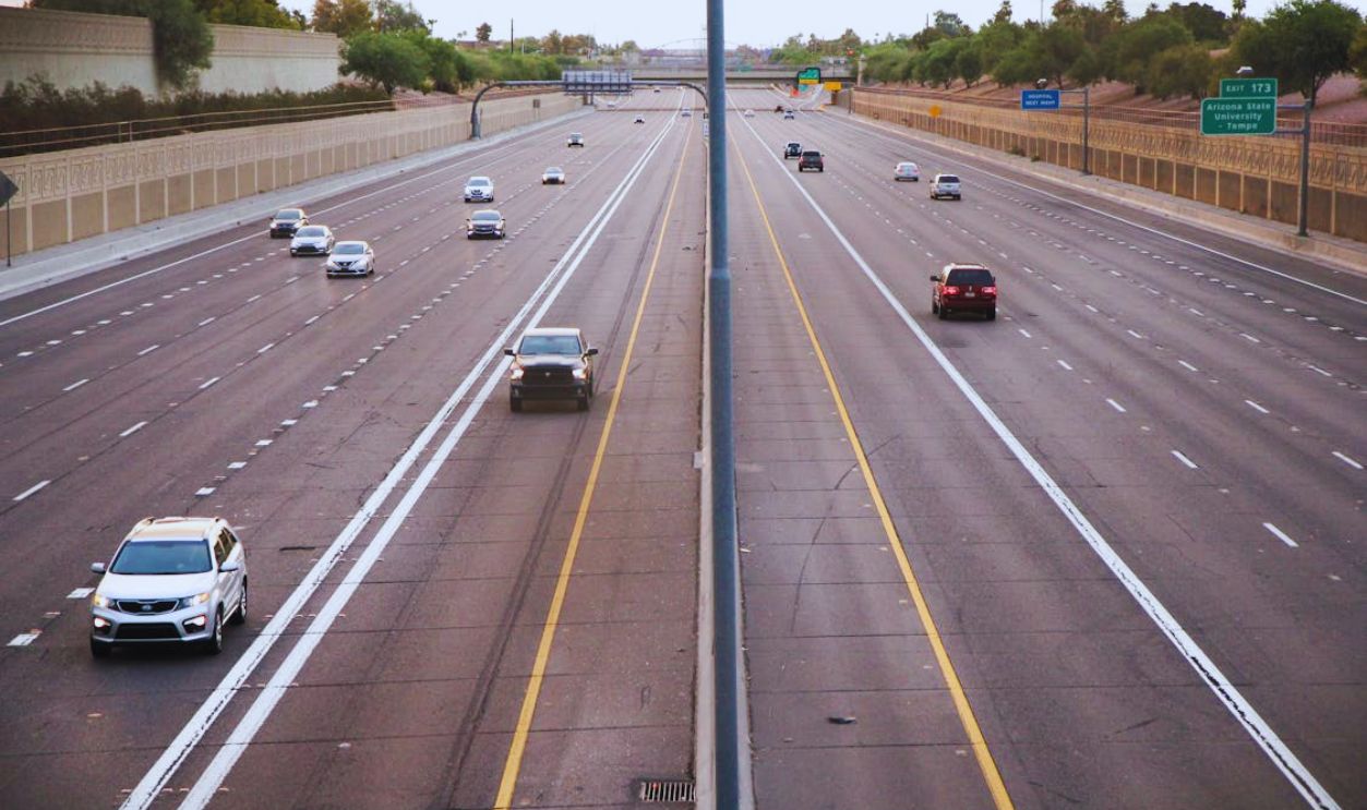 High-Angle Shot of Cars Driving on the Asphalt Road