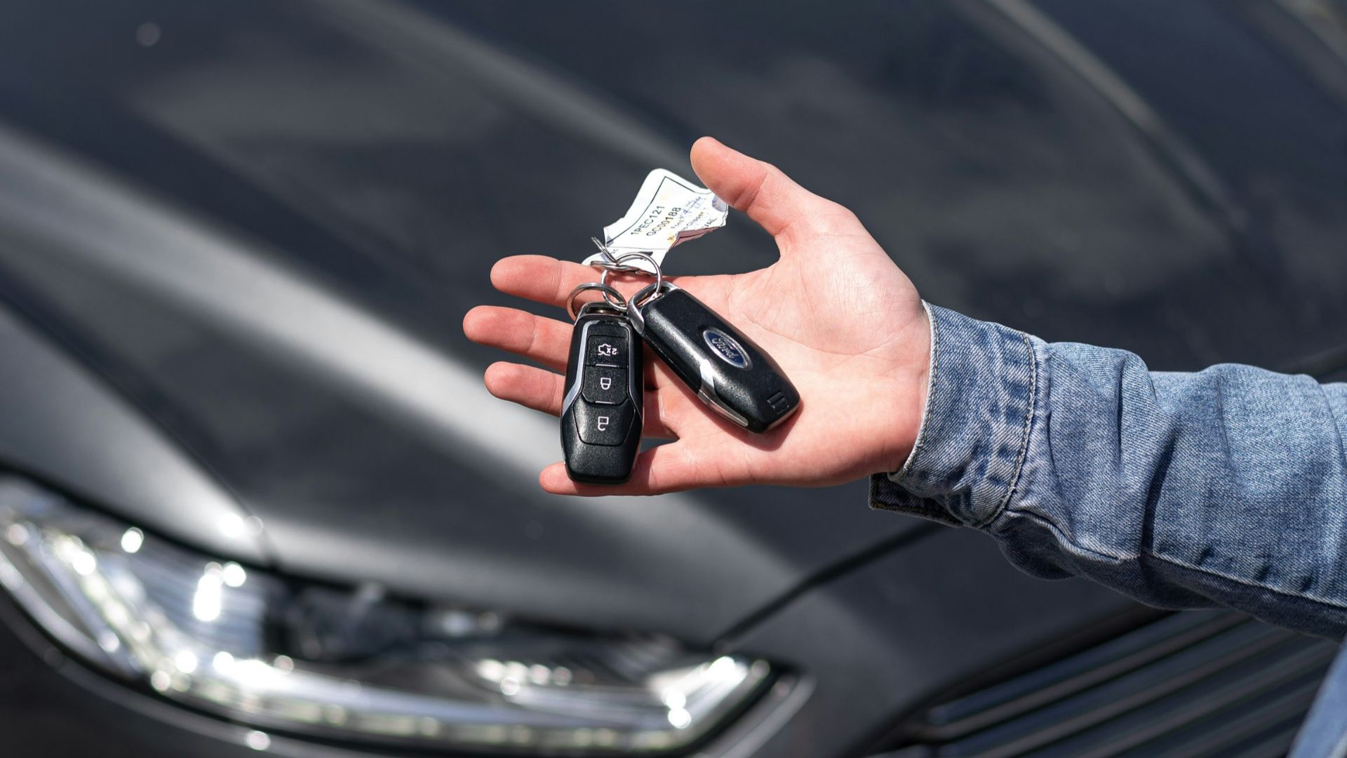 a hand holding a key