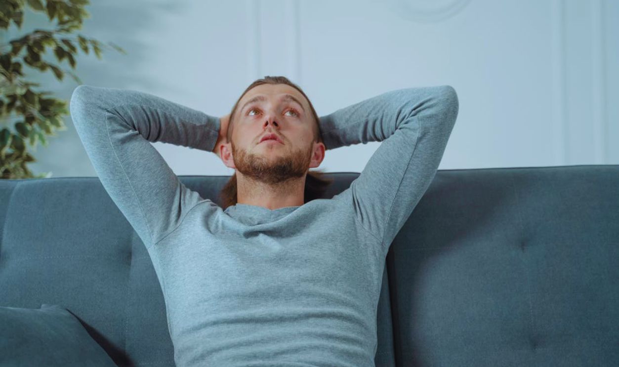 Stressed Man in Gray Sweatshirt