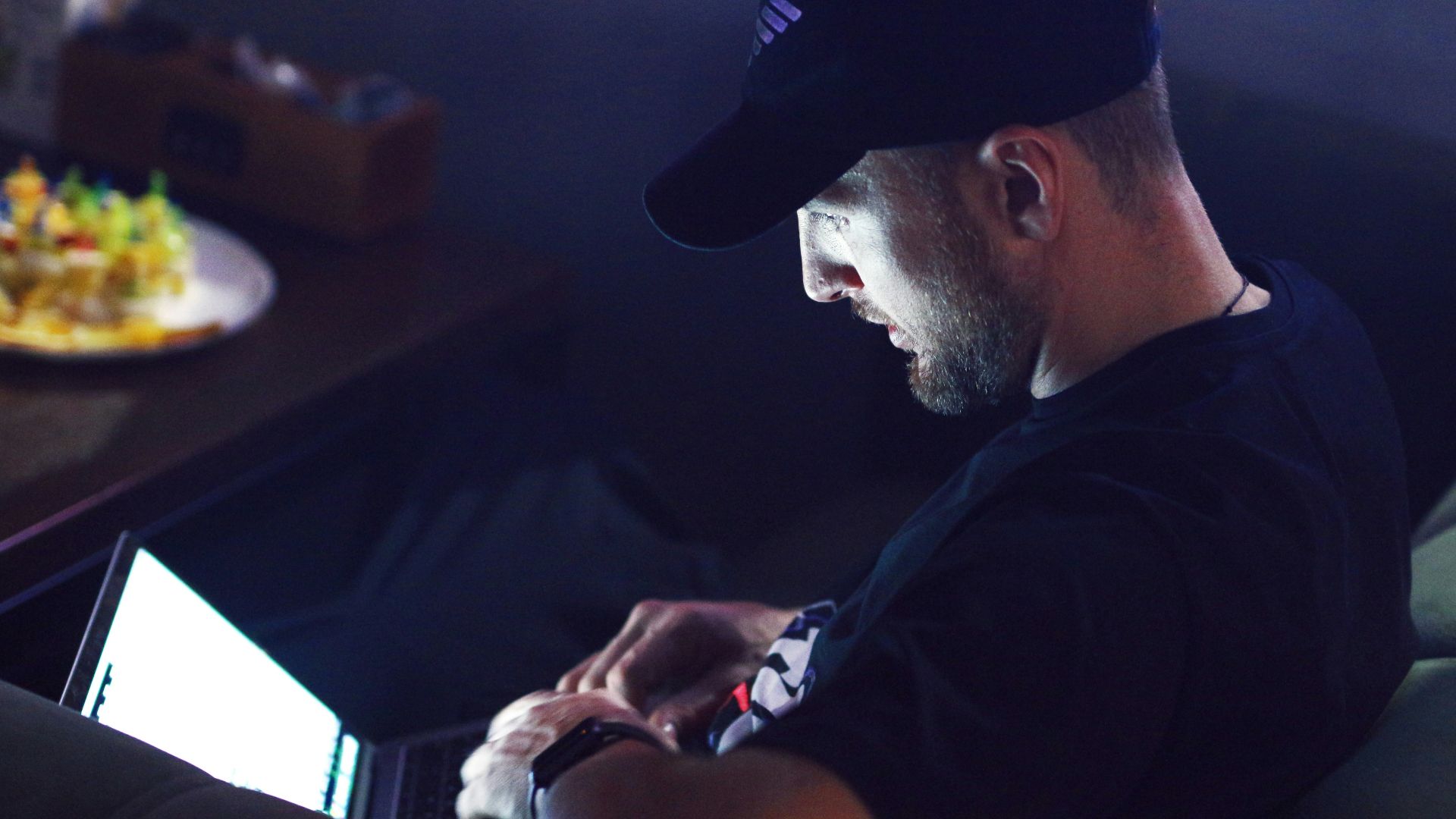 a man sitting in front of a computer