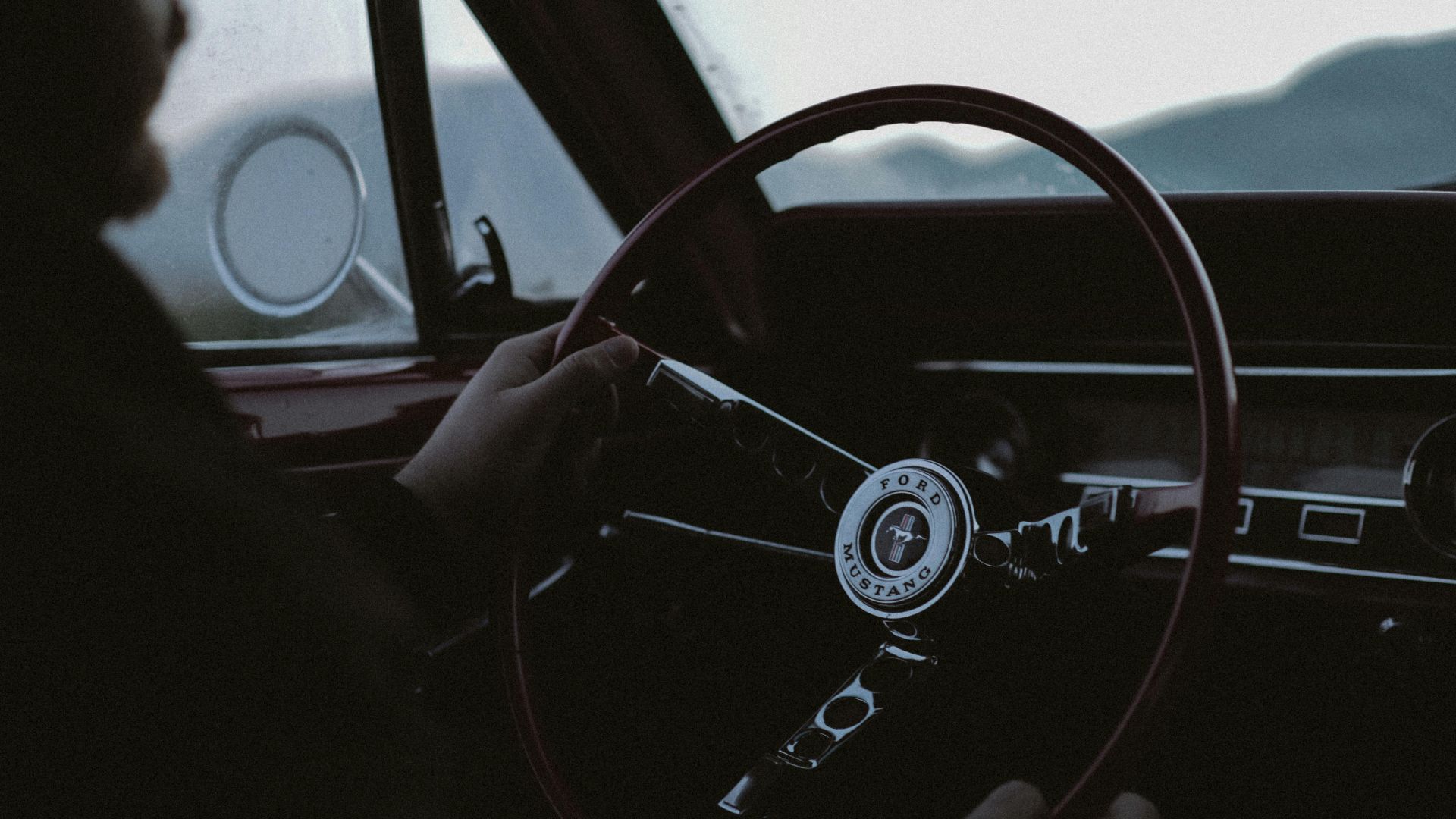 Experience the nostalgia of driving a classic Ford Mustang with vintage dashboard details.