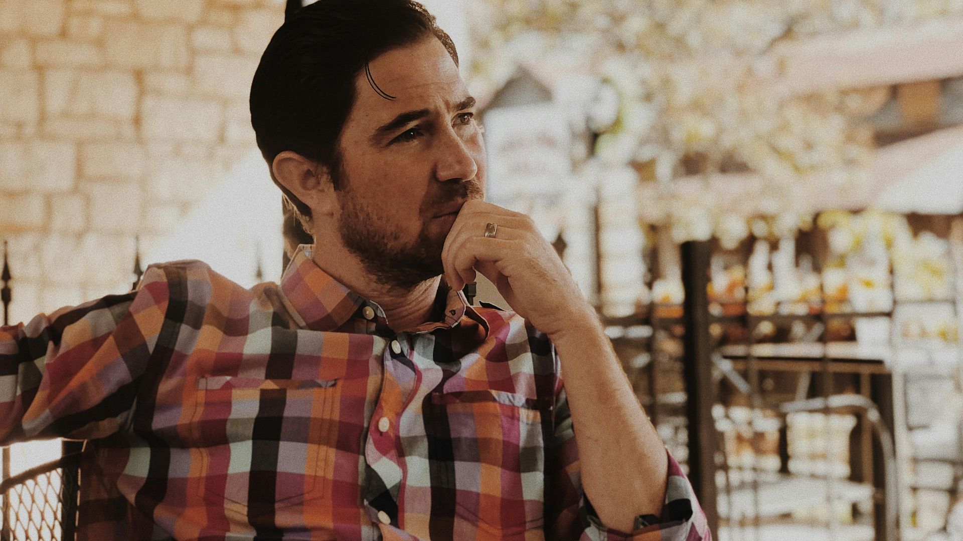 man in red and black plaid dress shirt