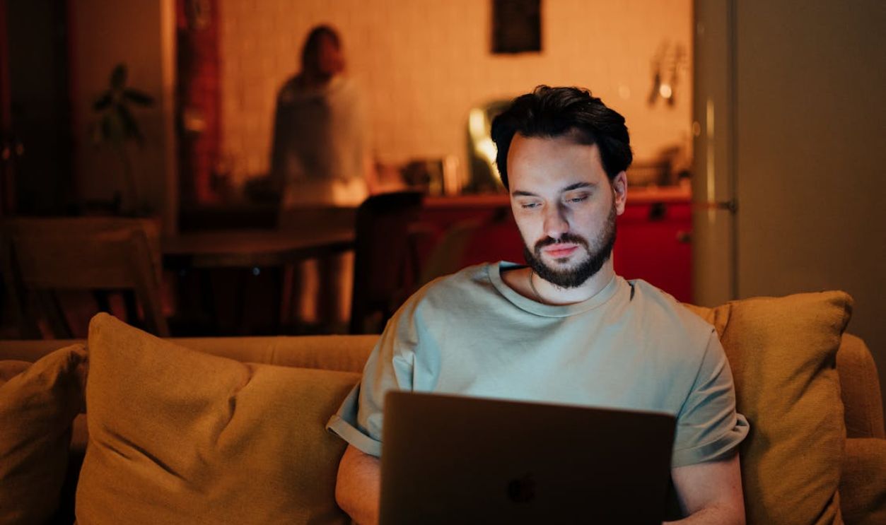 man using laptop at home