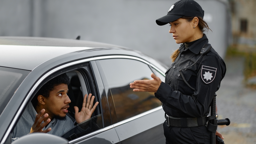 Car driver arguing with traffic police woman