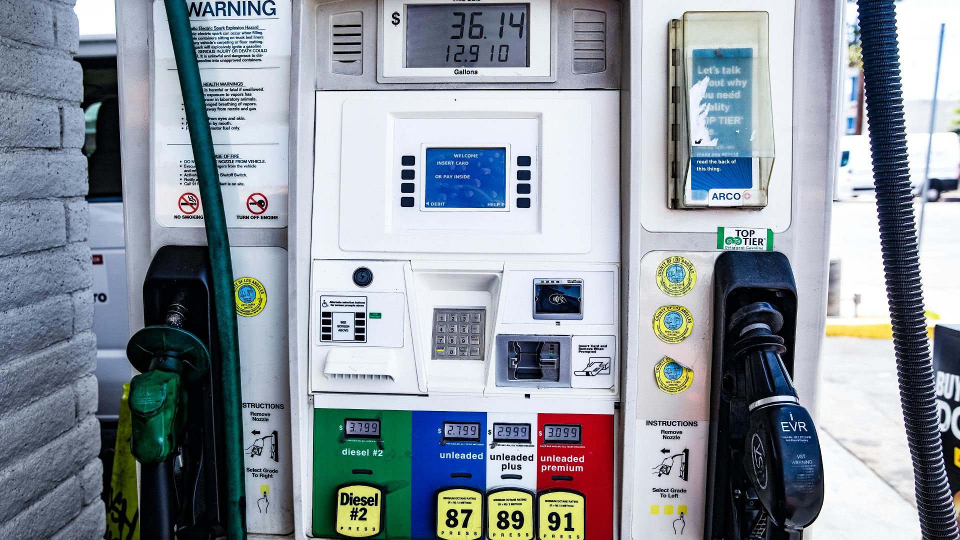 Close-up of a fuel pump showing gasoline and diesel options at a gas station in Los Angeles.