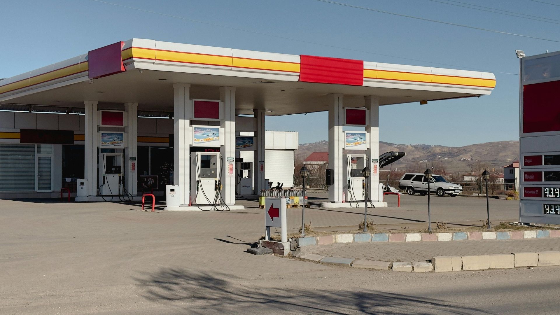 Daytime view of a petrol station in Kovancılar, Elazığ, with clear blue skies.