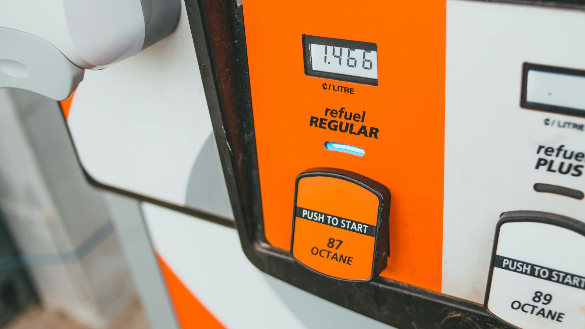 Detailed view of a gas pump showing price and octane level 87.
