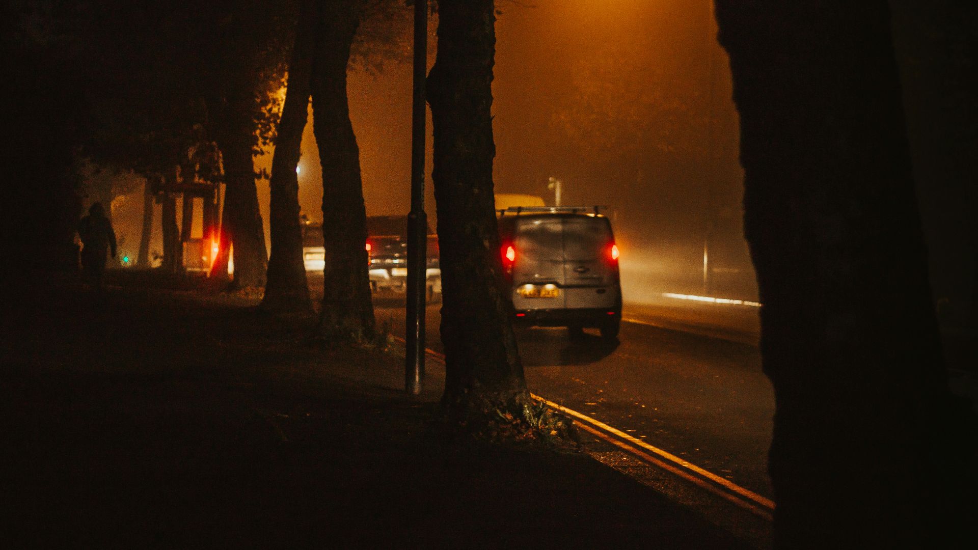 black car on road during sunset