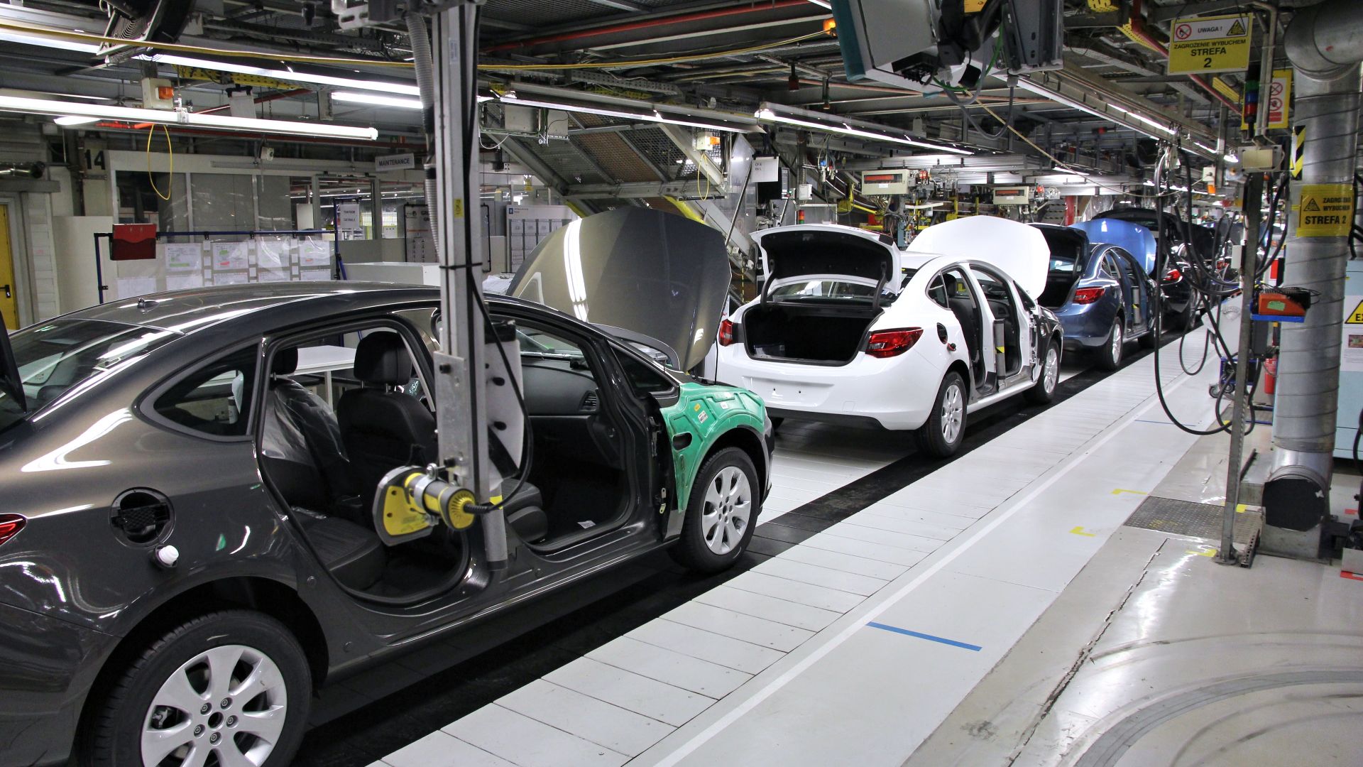 Car factory assembly line. Opel Astra J manufactured in General Motors Manufacturing Poland plant in Gliwice.