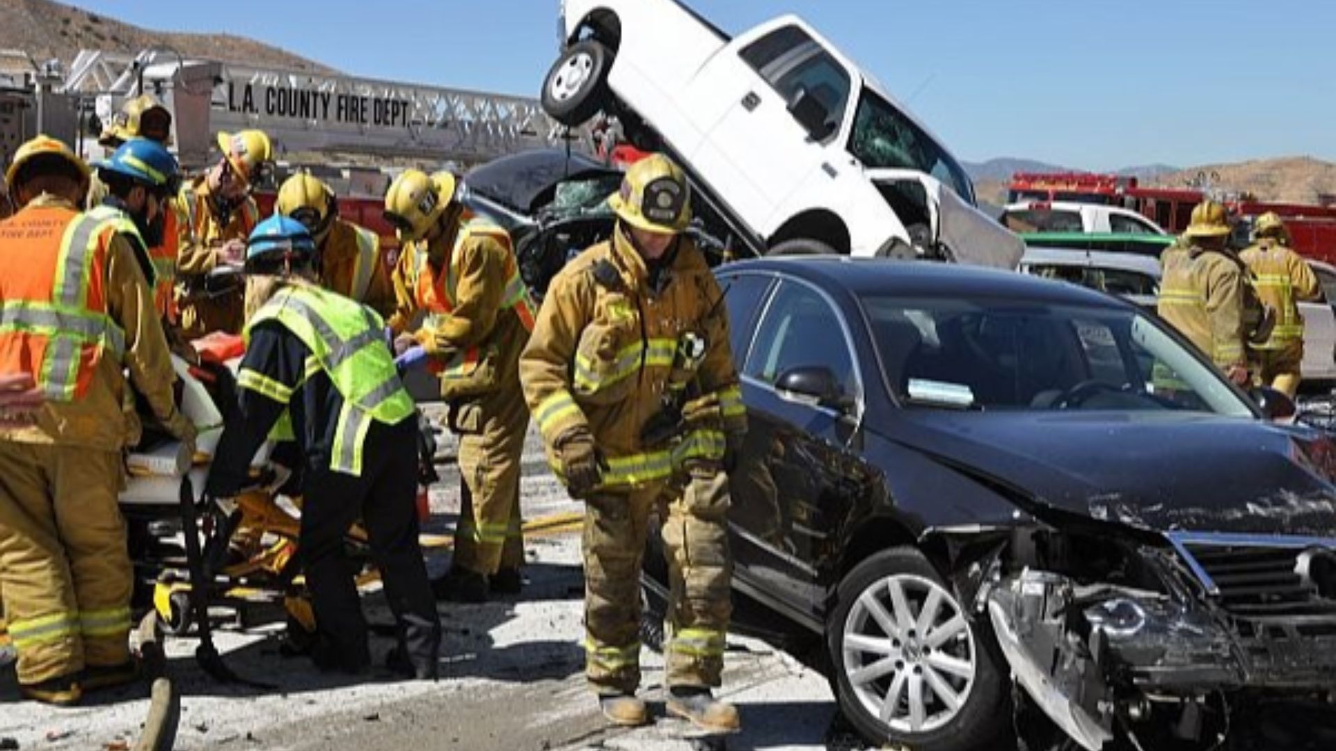 Firefighting paramedics remove an injured motorist after an accident Tuesday June 26, 2012 at the site of a freeway pileup in northern Los Angeles County. A big-rig truck and nearly 20 cars collided on the freeway, leaving at least 17 people injured, including two critically, authorities said. Photo by Car accident case lawyer, California