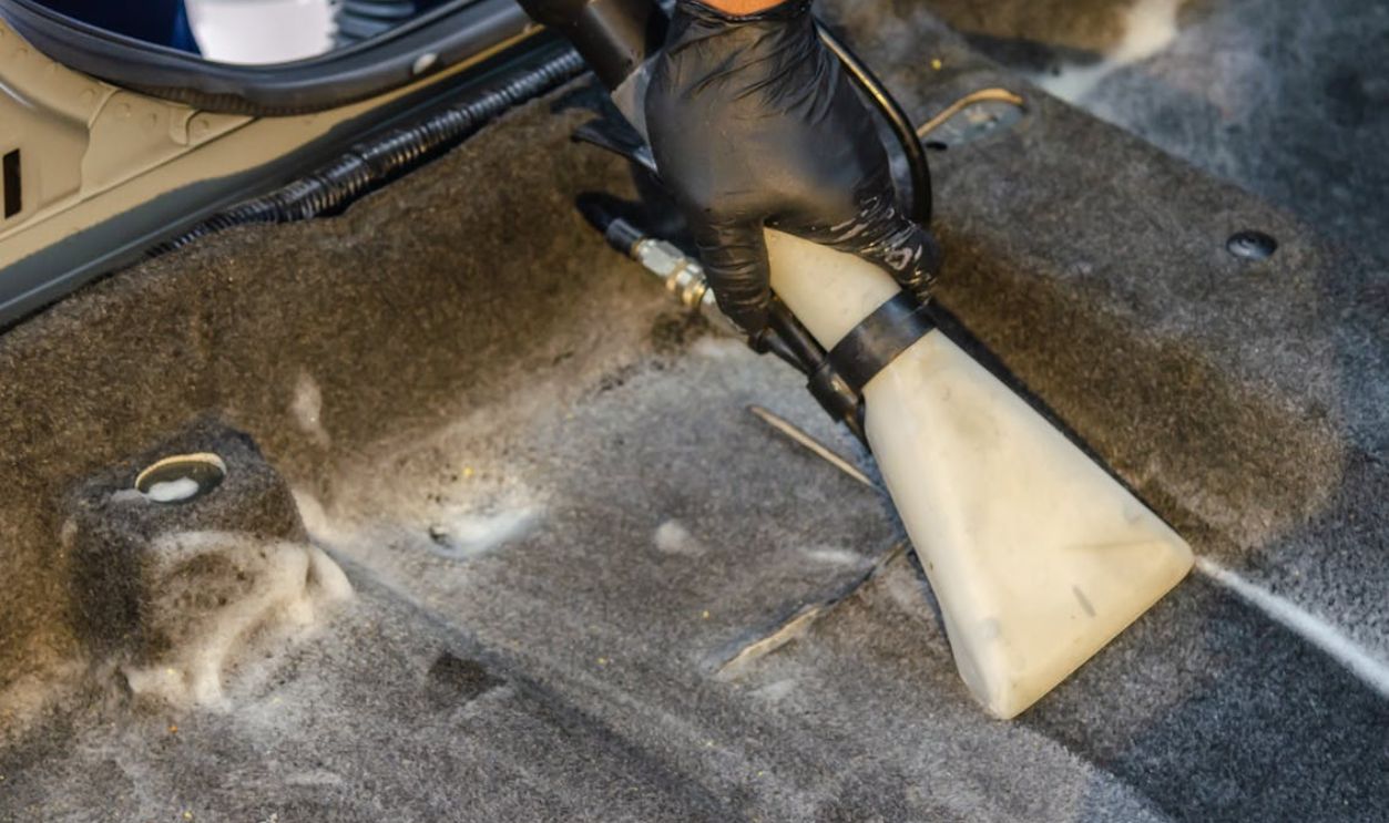 Hand Holding a Car Vacuum Cleaner