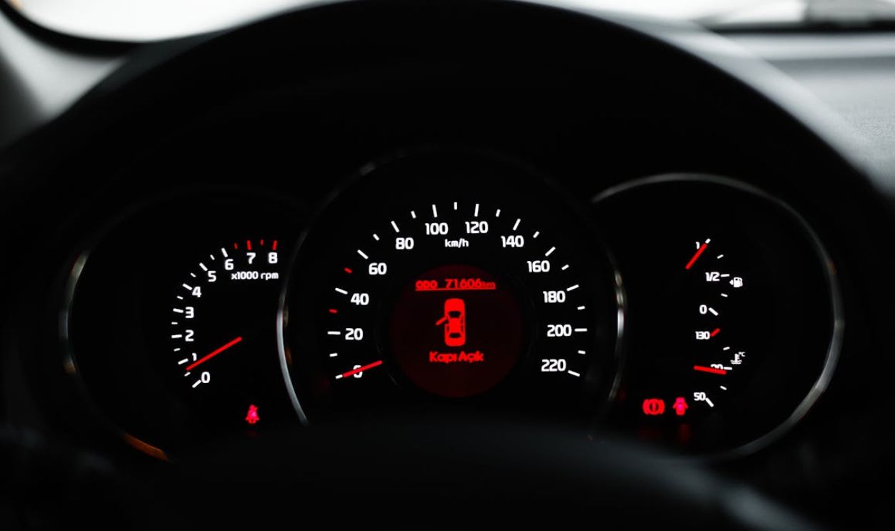 Close-Up of Car Dashboard with Warning Light