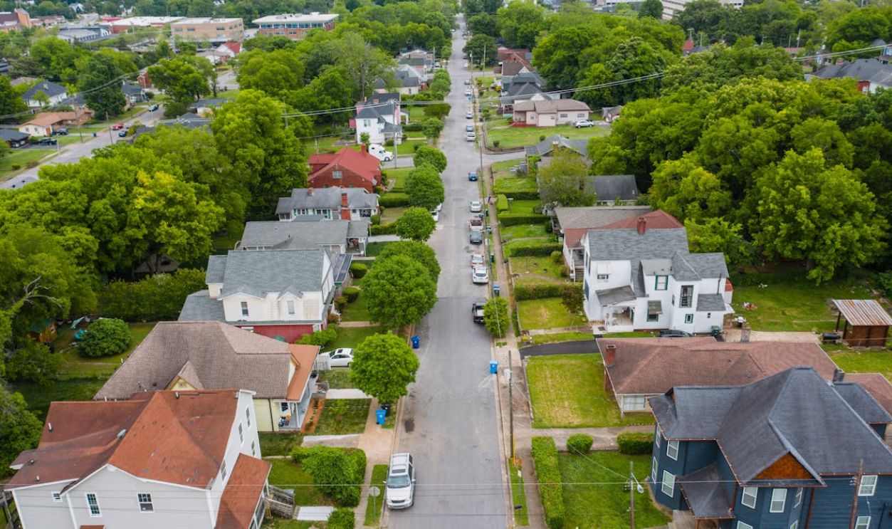 Asphalt Road in Between Houses