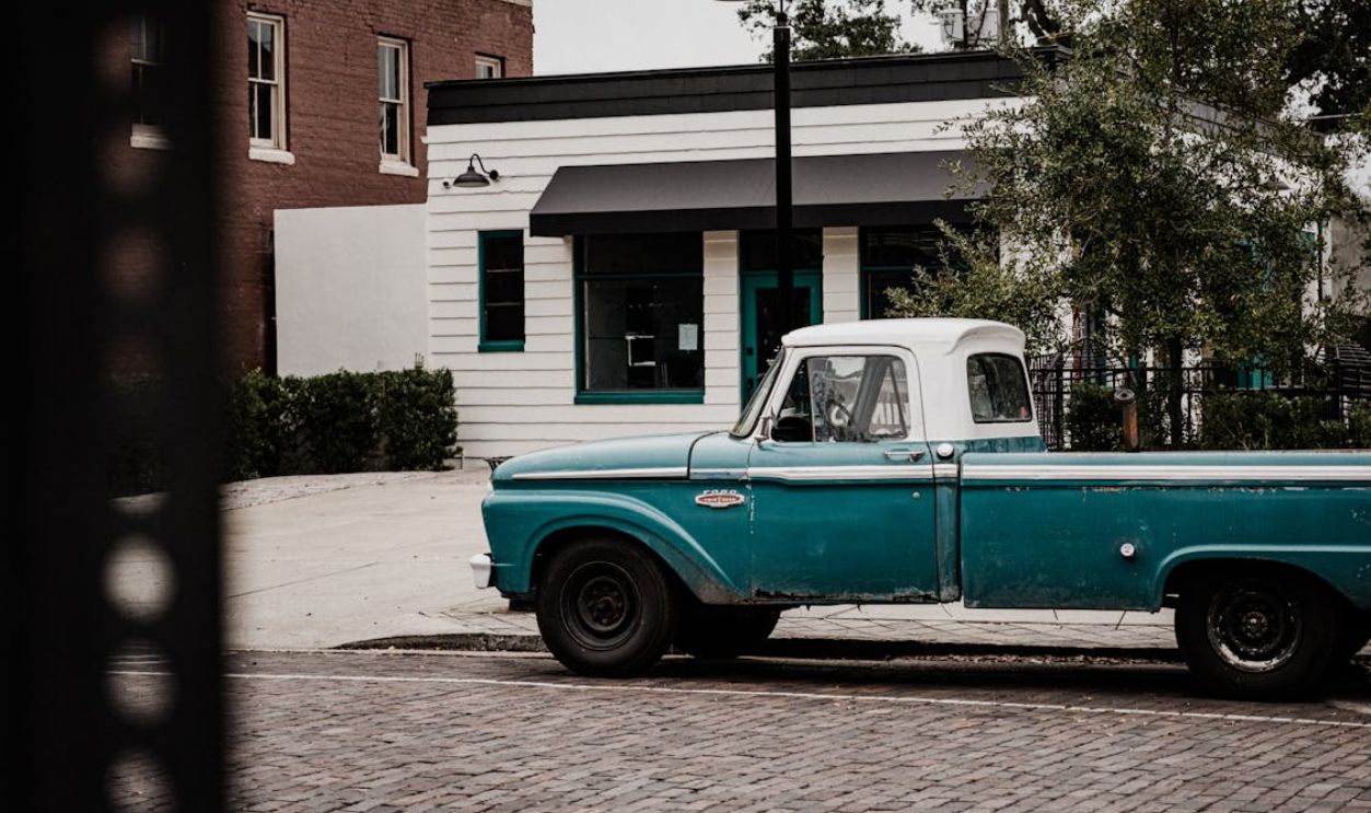 Photo of Blue Classic Pick Up Truck Parked on Roadside